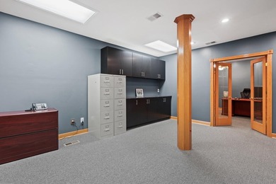 The main level offers 1,365 square feet, providing four offices - photo 6