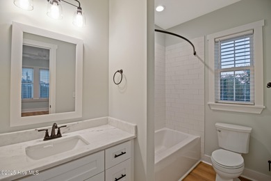 Experience refined coastal living in the heart of Emerald Isle