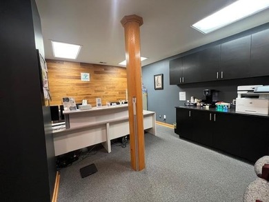 The main level offers 1,365 square feet, providing four offices - photo 8