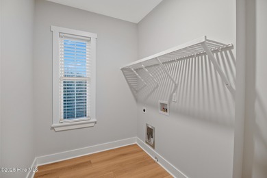 Experience refined coastal living in the heart of Emerald Isle