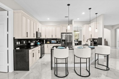 Welcome to this thoughtfully designed single-story residence in - photo 1