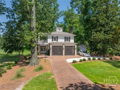 Tucked gracefully into its surroundings, and overlooking the - photo 2