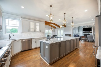 This LAVISH and STUNNING home on the lake offers a blend of - photo 27