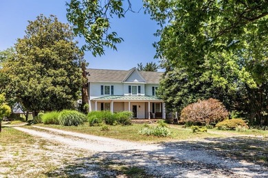 Welcome to this extraordinary circa-1911 estate nestled at the - photo 1