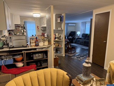 Nicely updated home w/new LVP flooring, metal roof, updated