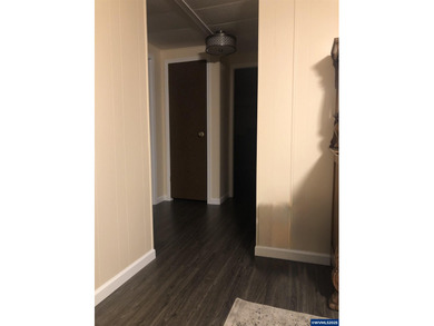 Nicely updated home w/new LVP flooring, metal roof, updated