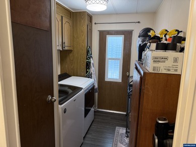 Nicely updated home w/new LVP flooring, metal roof, updated