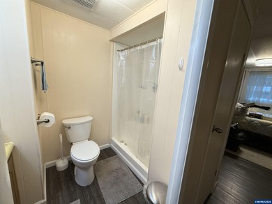 Nicely updated home w/new LVP flooring, metal roof, updated