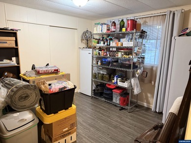 Nicely updated home w/new LVP flooring, metal roof, updated