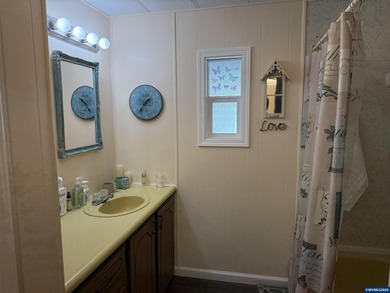 Nicely updated home w/new LVP flooring, metal roof, updated