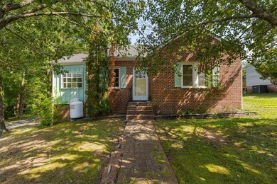 Charming 2-bedroom, 1-bath brick home situated on a corner lot - photo 1