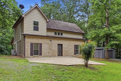 Tucked into a private, wooded setting just minutes from Center - photo 11