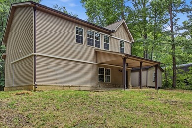 Tucked into a private, wooded setting just minutes from Center - photo 14