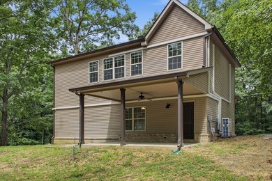 Tucked into a private, wooded setting just minutes from Center - photo 15