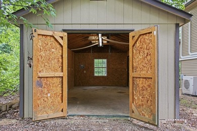 Tucked into a private, wooded setting just minutes from Center - photo 16