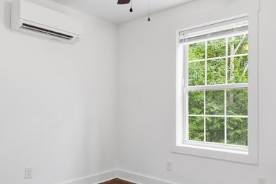 Tucked into a private, wooded setting just minutes from Center - photo 29