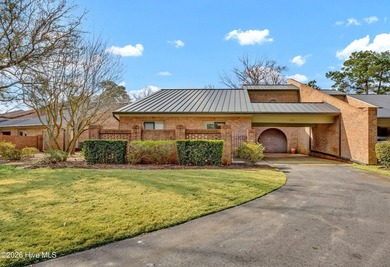 Coveted Landfall townhouse condominium in Colony Club! This end