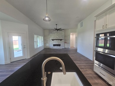 This beautifully designed one-level home offers 2,067 square