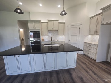 This beautifully designed one-level home offers 2,067 square