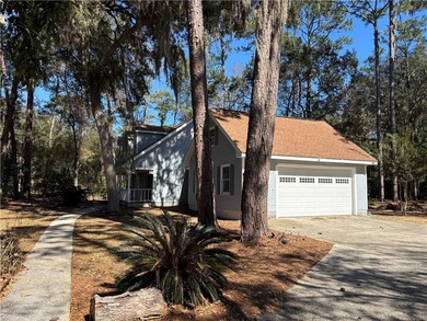 This comfortable cape/colonial home sits on a beautiful wooded - photo 3