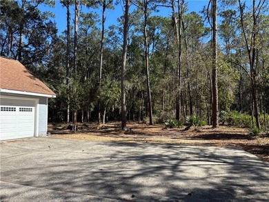 This comfortable cape/colonial home sits on a beautiful wooded - photo 4