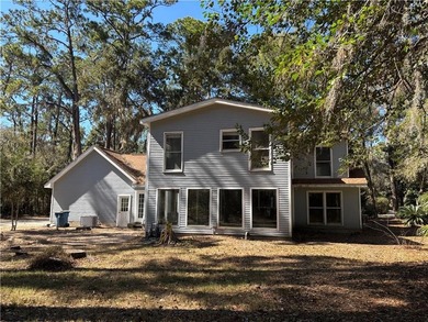 This comfortable cape/colonial home sits on a beautiful wooded - photo 6