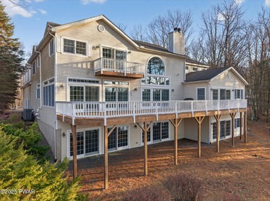 Welcome to this immaculate 4-bedroom LAKEFRONT home in the - photo 3