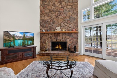 Welcome to this immaculate 4-bedroom LAKEFRONT home in the - photo 8