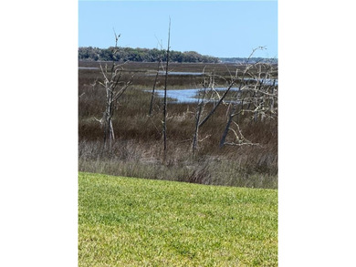 Marshfront Retreat in gated Fiddler's Cove, this home offers - photo 3