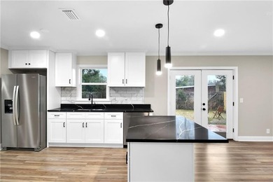 This house has it all. New Roof. New Garage. New floors. (LVP) - photo 5