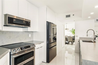 Designer-renovated 2BD + den / 2BA corner residence offering 1