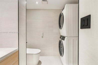 Designer-renovated 2BD + den / 2BA corner residence offering 1