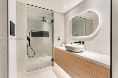 Designer-renovated 2BD + den / 2BA corner residence offering 1