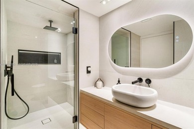 Designer-renovated 2BD + den / 2BA corner residence offering 1