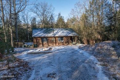 Privately set log home offering total privacy and backing to