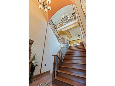 Commanding a premier position at the point of Bayou Grande, this