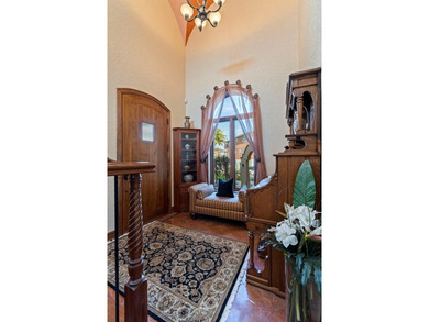 Commanding a premier position at the point of Bayou Grande, this