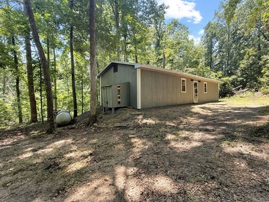 SECLUDED! Tucked away on 1.75 wooded acres, this cute 3-bedroom - photo 12