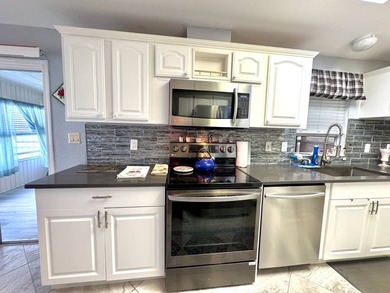 Partially furnished and move-in ready - just bring your - photo 22