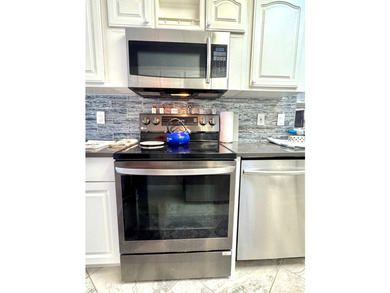 Partially furnished and move-in ready - just bring your - photo 23
