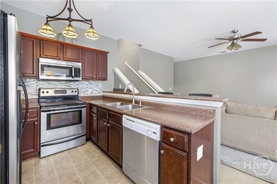 Welcome to 13 Orchid Lane, a charming 3-bedroom, 2-bath end-unit - photo 4