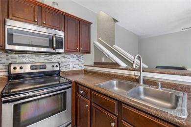 Welcome to 13 Orchid Lane, a charming 3-bedroom, 2-bath end-unit - photo 6