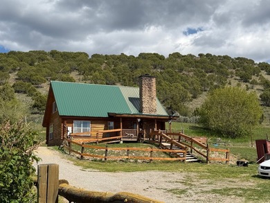 Escape to Bear Lake and enjoy the character of this log cabin - photo 1