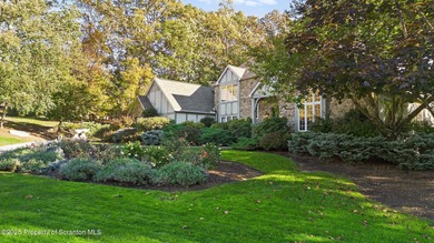 Welcome to this architecturally striking Tudor-inspired