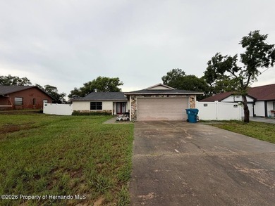 Welcome to this spacious 3-bedroom, 2-bath home featuring a - photo 1