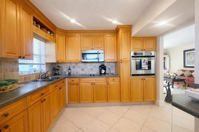 This exceptional two-bedroom, two-bath residence offers refined