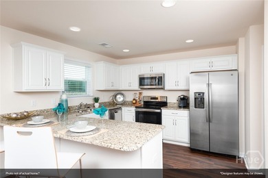The Guilford offers 4 bedrooms, 2.5 baths, and a thoughtfully - photo 4