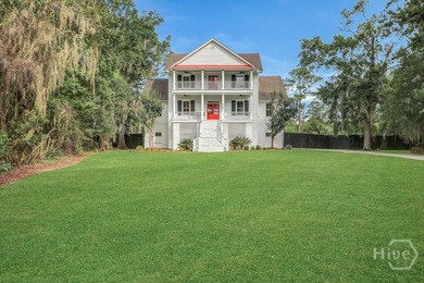 Situated on over an acre of beautifully landscaped marshfront - photo 3