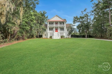 Situated on over an acre of beautifully landscaped marshfront - photo 4