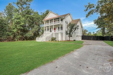 Situated on over an acre of beautifully landscaped marshfront - photo 5